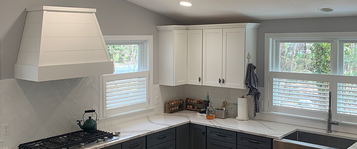 Mansfield, MA kitchen with white wood shutters from Hunter Douglas