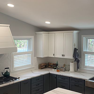  Mansfield, MA kitchen stove area with white wood shutters by Hunter Douglas