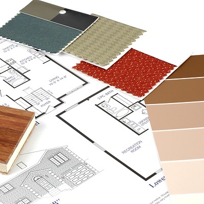 Interior decorating wood sample, cloth swatches and color samples, on top of building plans